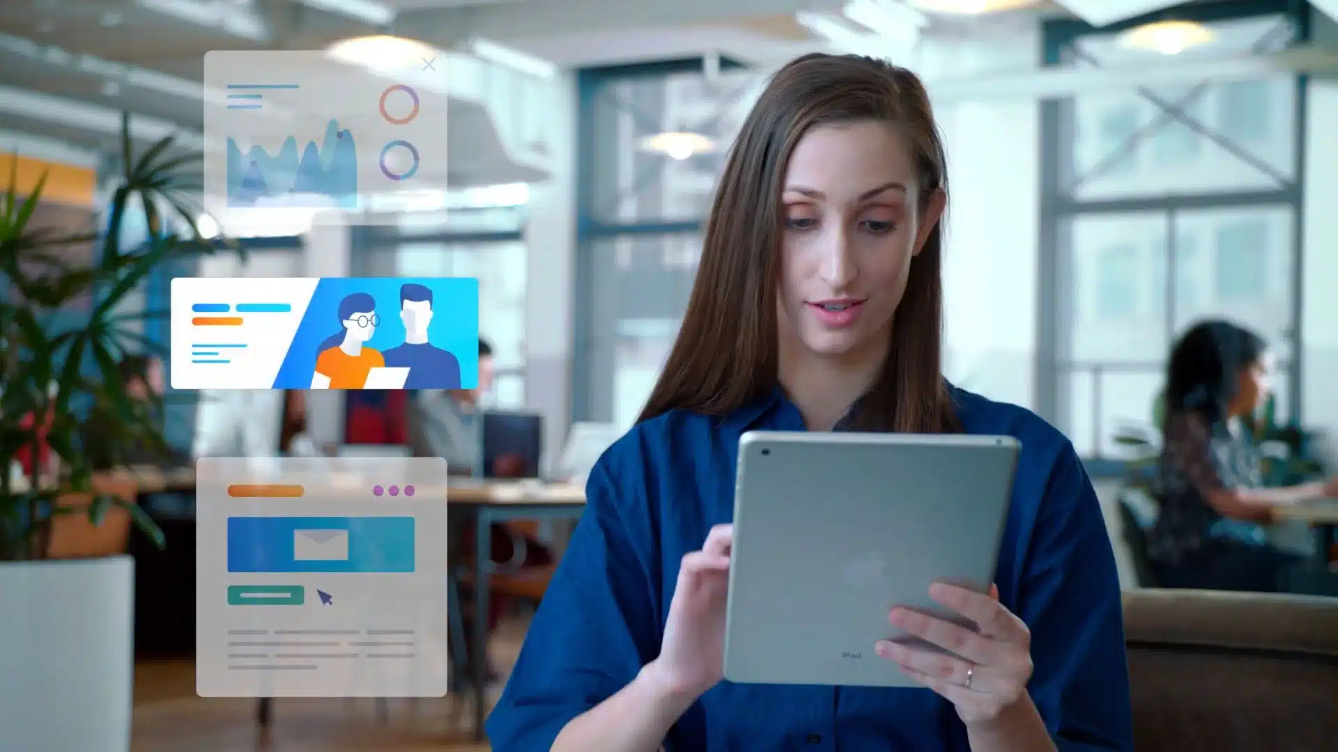 Woman using an iPad in an office with floating digital graphics of charts