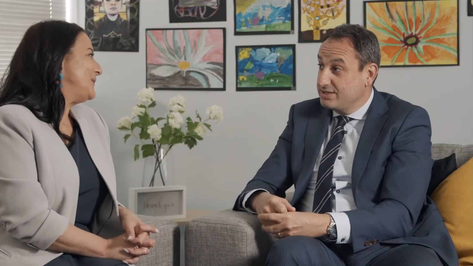 Two professionals discussing business in an office